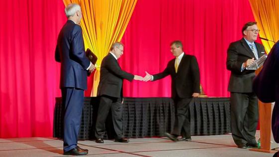 Don Gordon receiving Achievement level Governor’s Quality Award